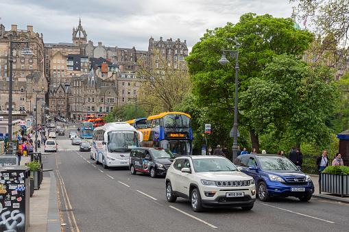 Edinburgh, Scotland - May 20, 2018: Street scene Edinburgh near Waverley Station with cars and pedestrians