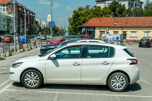 Novi Sad, Serbia. July - 31. 2018. White Citroen C4 car parked on the parking space in the city.