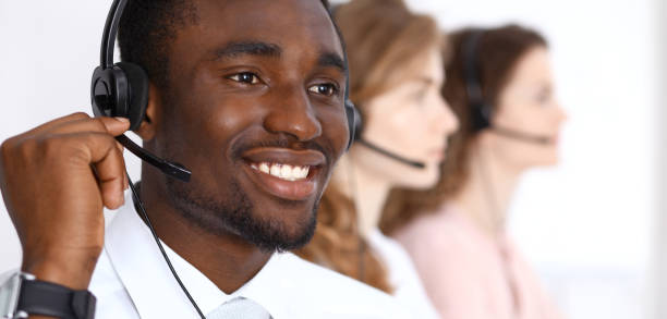 istock African american call operator in headset. Call center business or customer service concept 1017183624