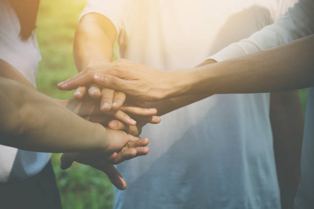 team teamwork business join hand together concept, power of volunteer charity work, stack of people hand - community teamwork human hand organization imagens e fotografias de stock