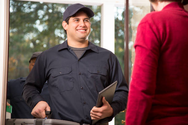 istock Repairmen arrive at customer's front door for home repairs. 1017190216