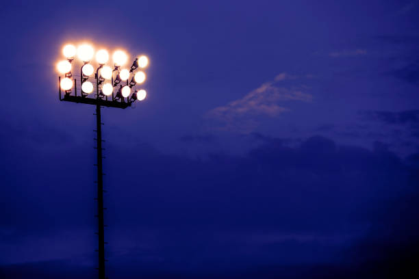 sports stadium lights at dusk, night. - soccer stadium soccer field sport imagens e fotografias de stock