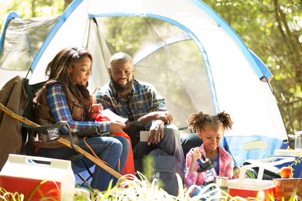 istock Family on summer or autumn vacation camping in forest. 1017193012