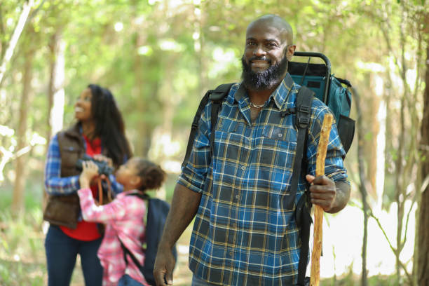 istock Family on summer or autumn vacation camping in forest. 1017193046