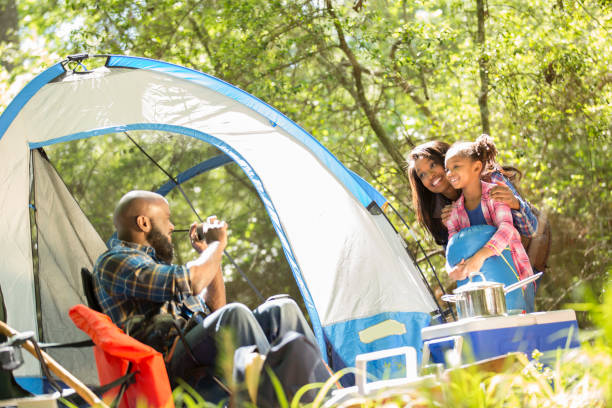 istock Family on summer or autumn vacation camping in forest. 1017193184