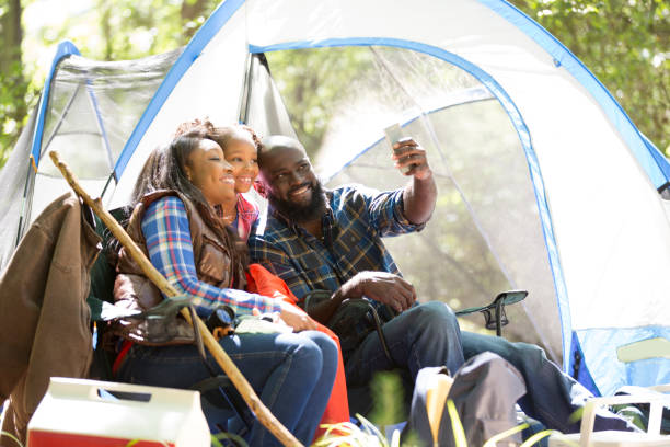 istock Family on summer or autumn vacation camping in forest. 1017193272
