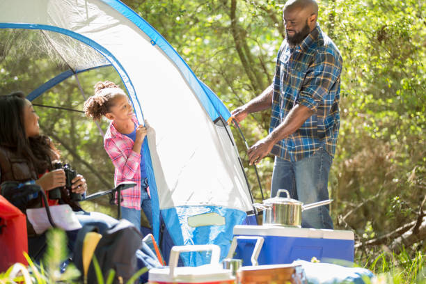 istock Family on summer or autumn vacation camping in forest. 1017193344