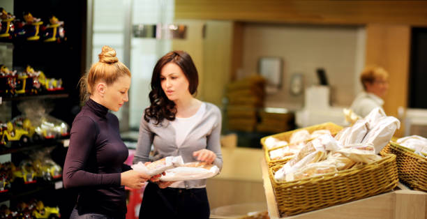 istock Women choosing bread  from a supermarket,selective focus 1017193722