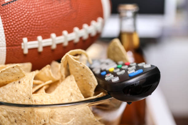 istock Watching the football game with snacks. 1017196378