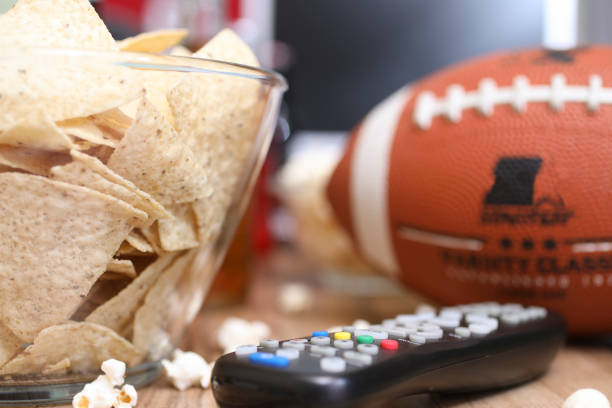 istock Watching the football game with snacks, drinks. 1017196442