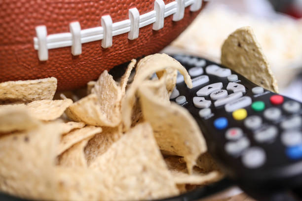 istock Watching the football game with snacks. 1017196458
