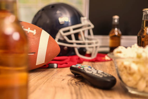 istock Watching the football game with snacks, drinks. 1017196484