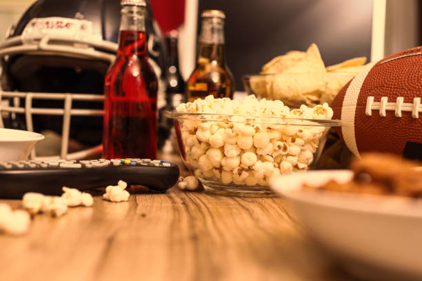 istock Watching the football game with snacks, drinks. 1017196516