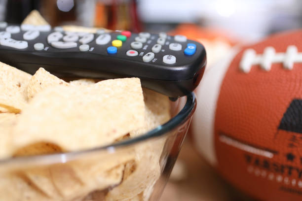 istock Watching the football game with snacks. 1017196554
