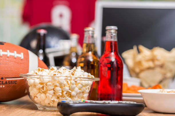 istock Watching the football game with snacks, drinks. 1017196566