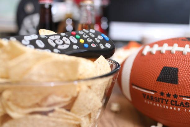 istock Watching the football game with snacks, drinks. 1017196578