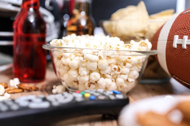istock Watching the football game with snacks, drinks. 1017196606