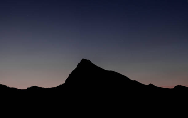 istock mountain landscape silhouette under a late evening sky after sunset 1017207542