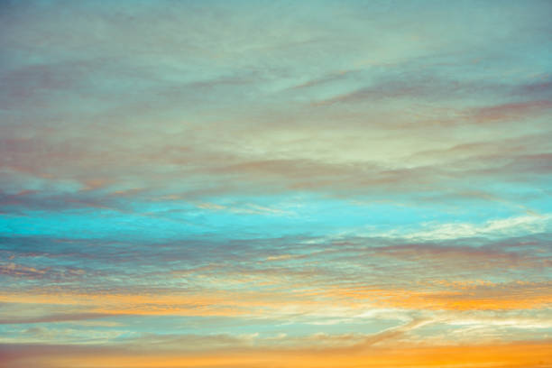 istock blue and orange sky clouds at sunset or sunrise. 1017207652