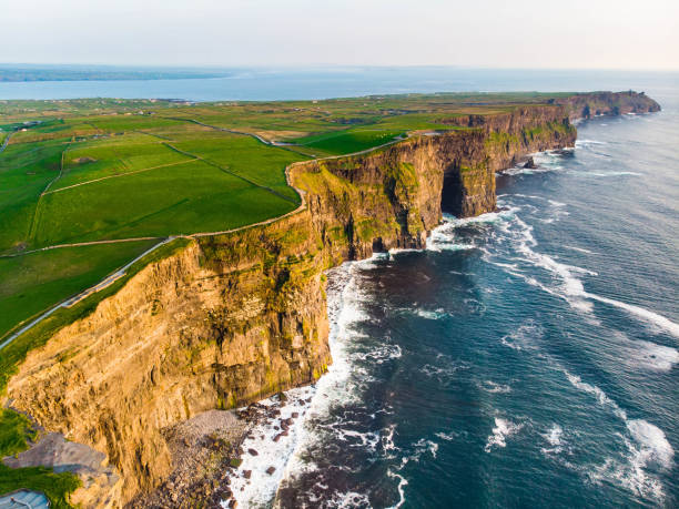 World famous Cliffs of Moher, one of the most popular tourist destinations in Ireland. World famous Cliffs of Moher, one of the most popular tourist destinations in Ireland. Aerial view of widely known tourist attraction on Wild Atlantic Way in County Clare. doolin photos stock pictures, royalty-free photos & images