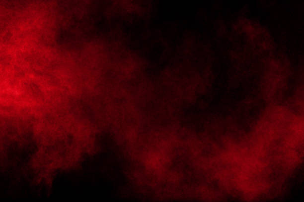istock abstract red dust explosion on  black background. abstract red powder splattered on  background, Freeze motion of red powder splash. 1017215690