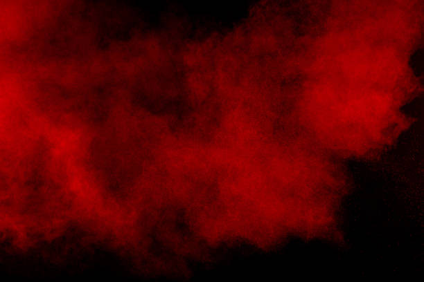 istock abstract red dust explosion on  black background. abstract red powder splattered on  background, Freeze motion of red powder splash. 1017215848