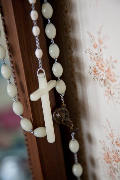 istock rosary hangs from bedroom mirror 1017217274