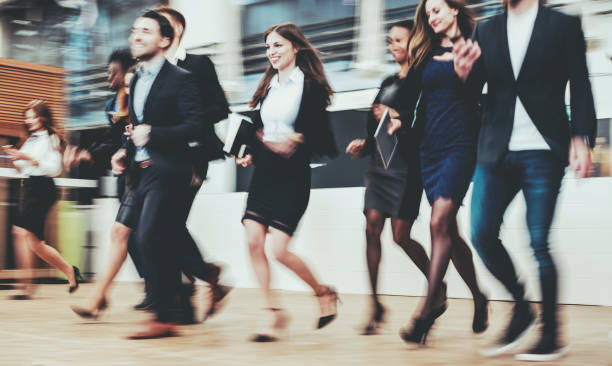 istock Group of business people in motion 1017231364