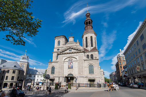 People walking by Notre-Dame de Québec Basilica-Cathedral at Quebec, Canada in front of the \