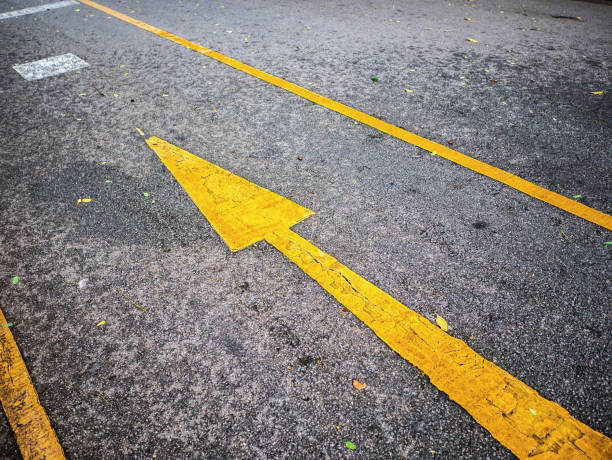 istock Yellow Forward sign on the road in the park 1017250562