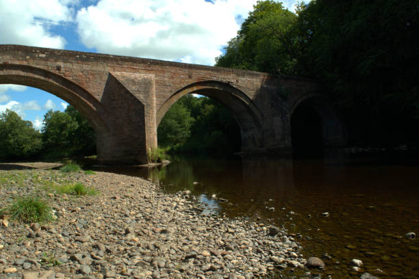istock Arched stone bridge over River Ayr at Stair, Scotland 1017251154