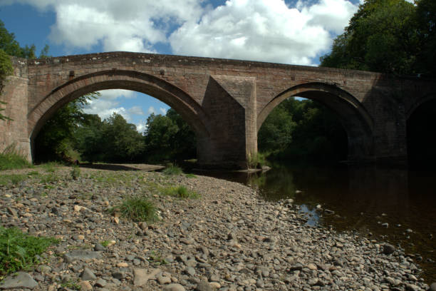 istock Arched stone bridge over River Ayr at Stair, Scotland 1017251308