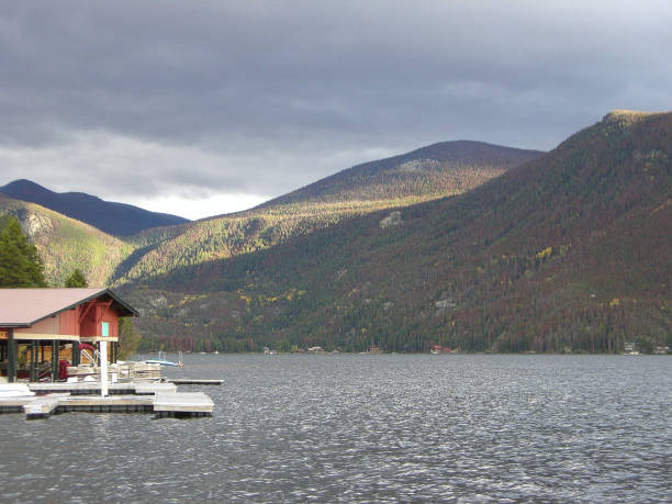 istock a lake with a house on the rocky mountains 1017255616
