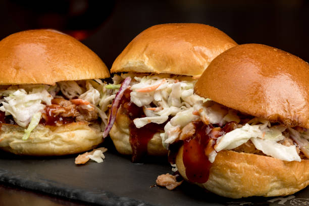 istock Close up of three perfectly built Pulled Pork Sliders 1017255920