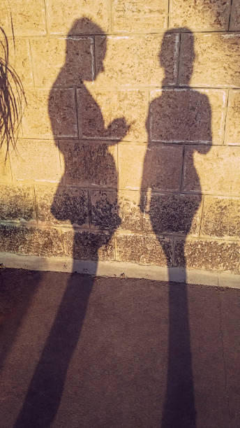 istock Shadow silhouettes againts an old wall 1017258842