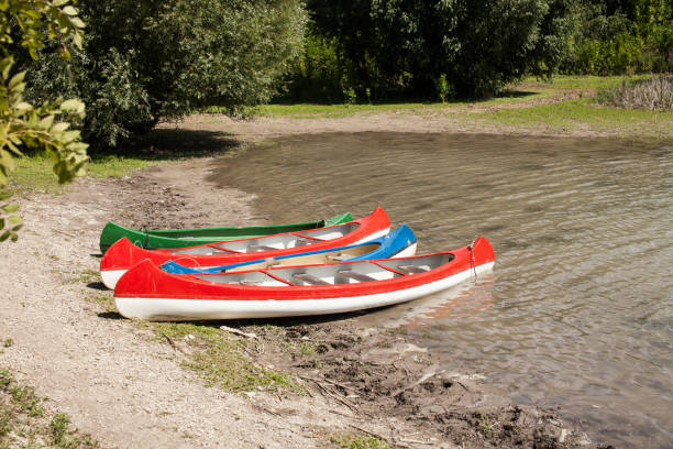 istock Boats on the mountain lake. Three canoes. 1017278384