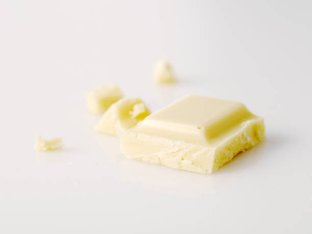istock Macro photo of Chocolate bar. Broken pieces over white background 1017290302