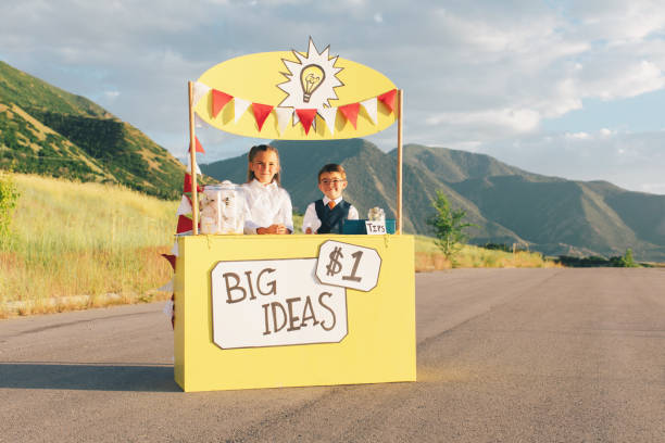 istock Young Business Team Runs Big Idea Stand 1017294170