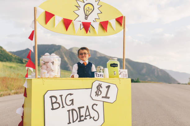 istock Young Business Boy Runs Big Idea Stand 1017294342