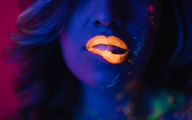 istock woman with fluorescent makeup 1017300350
