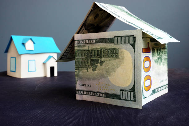 istock House from banknotes. Mortgage and loan for home concept. 1017300394
