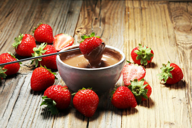 istock Fondue with Melting chocolate or melted chocolate and strawberry. 1017306000