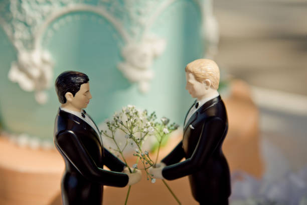 A wedding decoration with two grooms gay marriage cake topper civil partnership stock pictures, royalty-free photos & images
