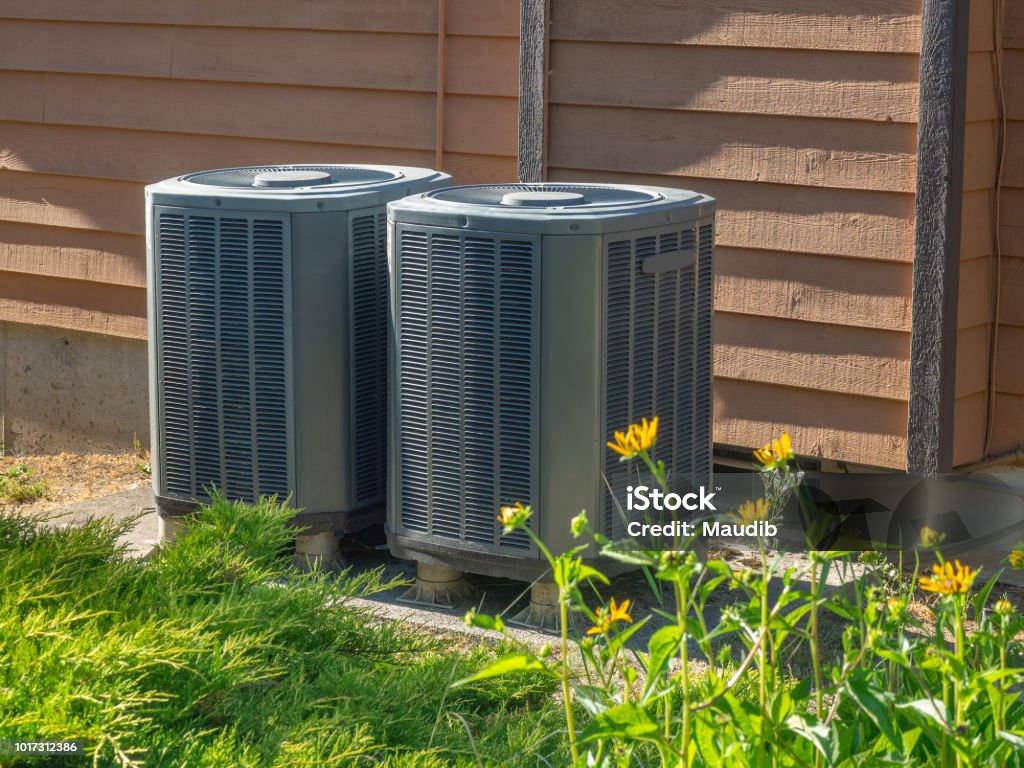 Air conditioning units outside an apartment complex High efficiency modern AC-heater inverter units, energy save solution-horizontal, outside an apartment complex Air Conditioner Stock Photo