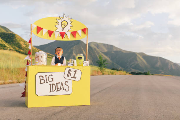 istock Young Business Boy Runs Big Idea Stand 1017316966