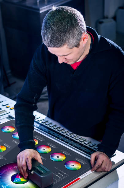 istock Man in the process of offset printing and color correction 1017328556