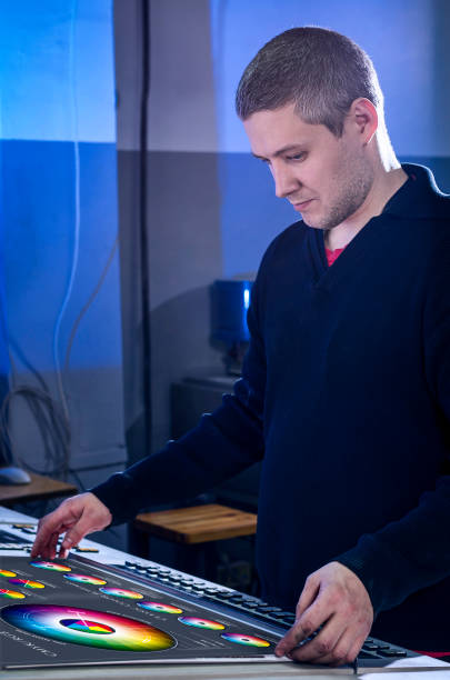 istock Man in the process of offset printing and color correction 1017328578