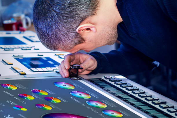 istock Man in the process of offset printing and color correction 1017328642