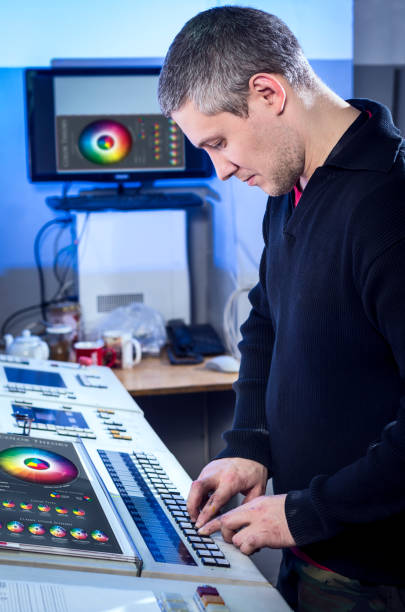 istock Man in the process of offset printing and color correction 1017328650