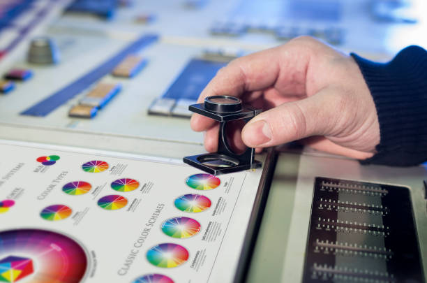 istock Man in the process of offset printing and color correction 1017328660
